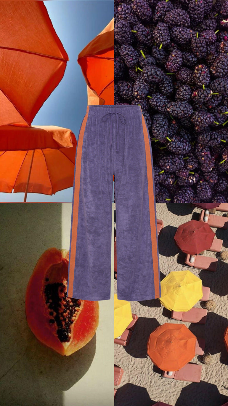 Collage of orange umbrellas, purple grapes, blue pants, and a papaya with a colourful patterned background.