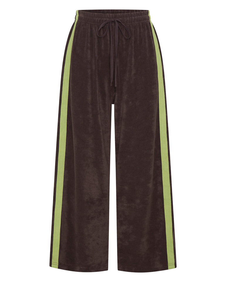 Brown terry towelling pants with green side stripes on a white background