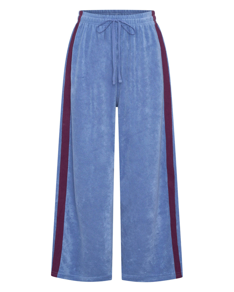 Blue pants with red side stripes on a white background