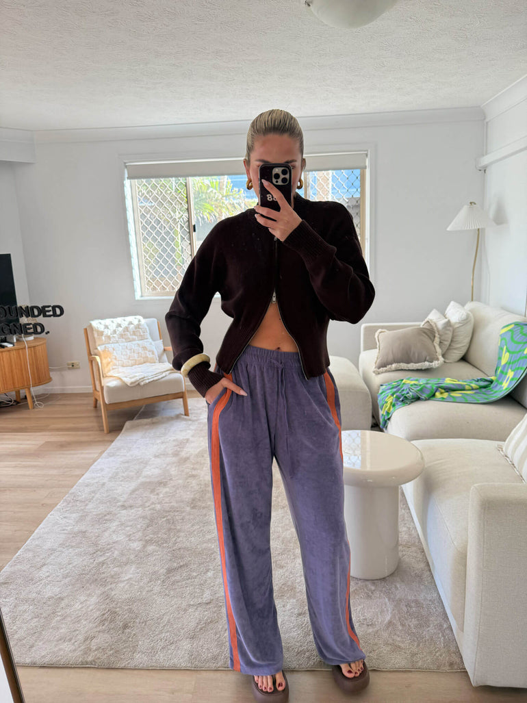 Person taking a mirror selfie in a modern living room