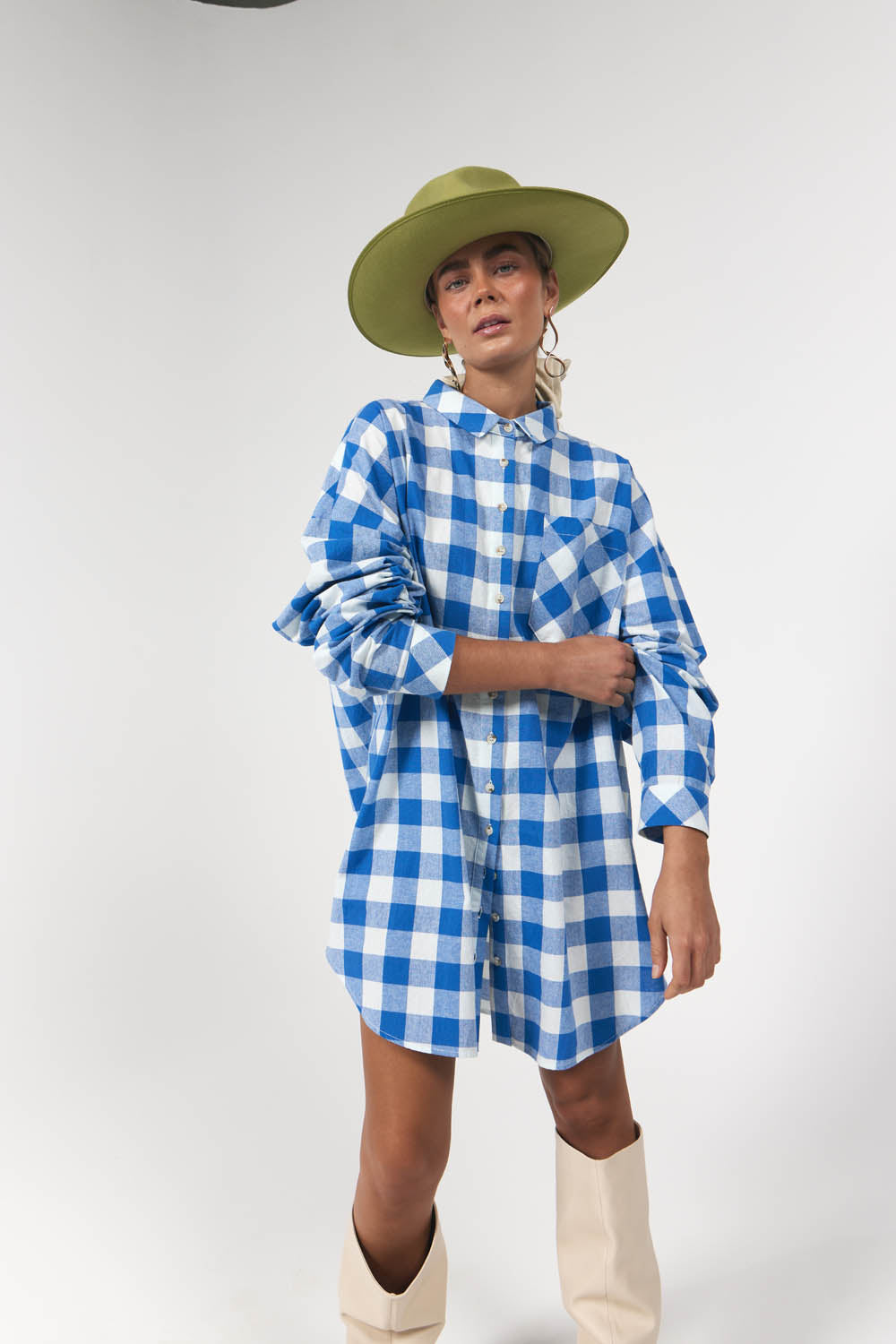 Model wearing blue and gingham oversized shirt