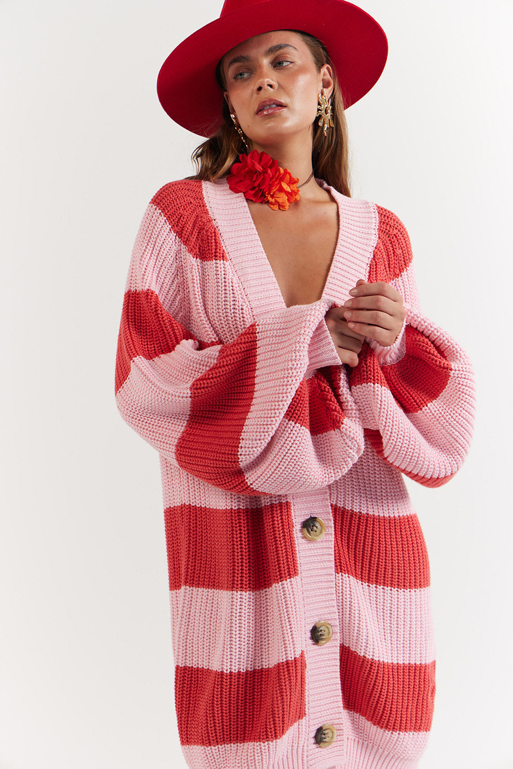 Woman wearing a red and pink striped cardigan - La Bohème Girls Elsie Knit Cardigan Candy Stripe