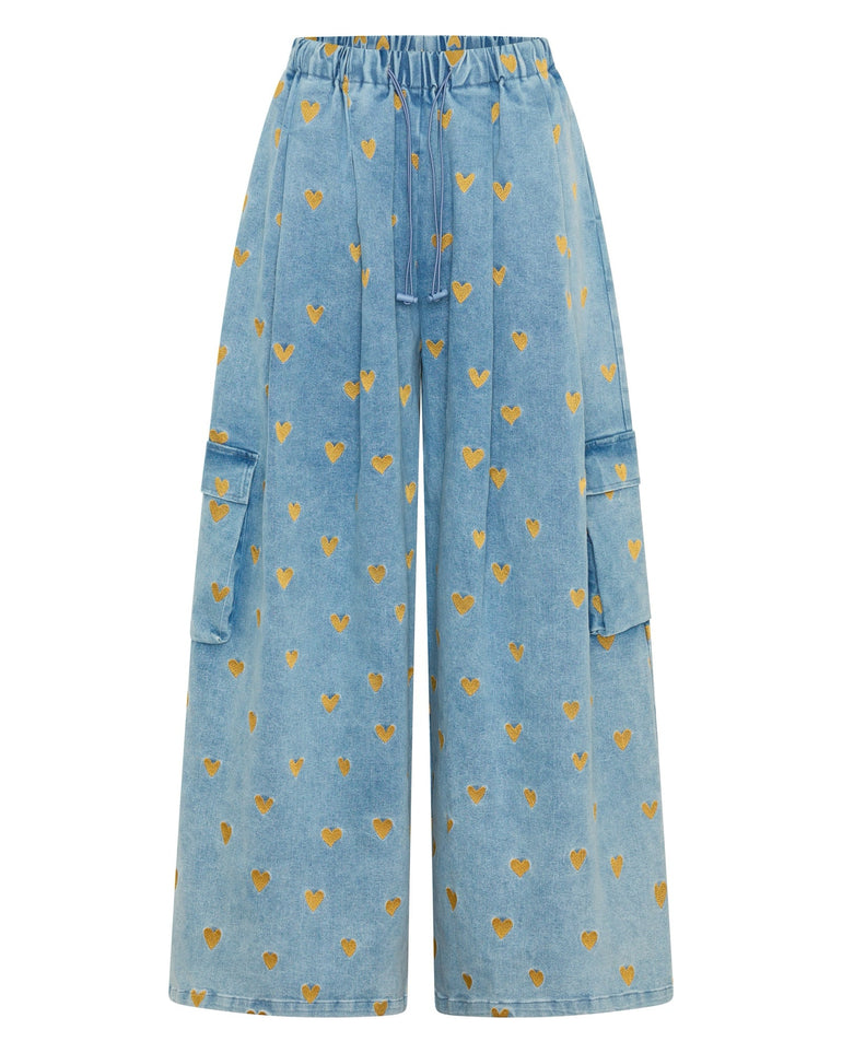 Blue denim pants with gold heart pattern