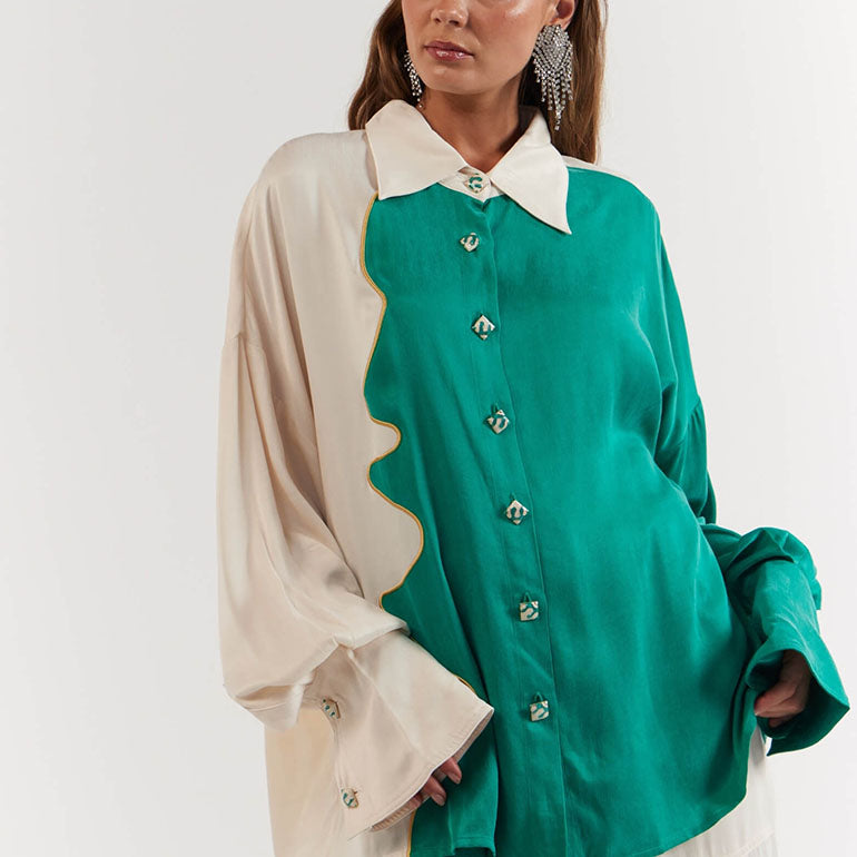 Woman wearing a green and beige blouse with a white collar n- Soleil Soiree - La Boheme