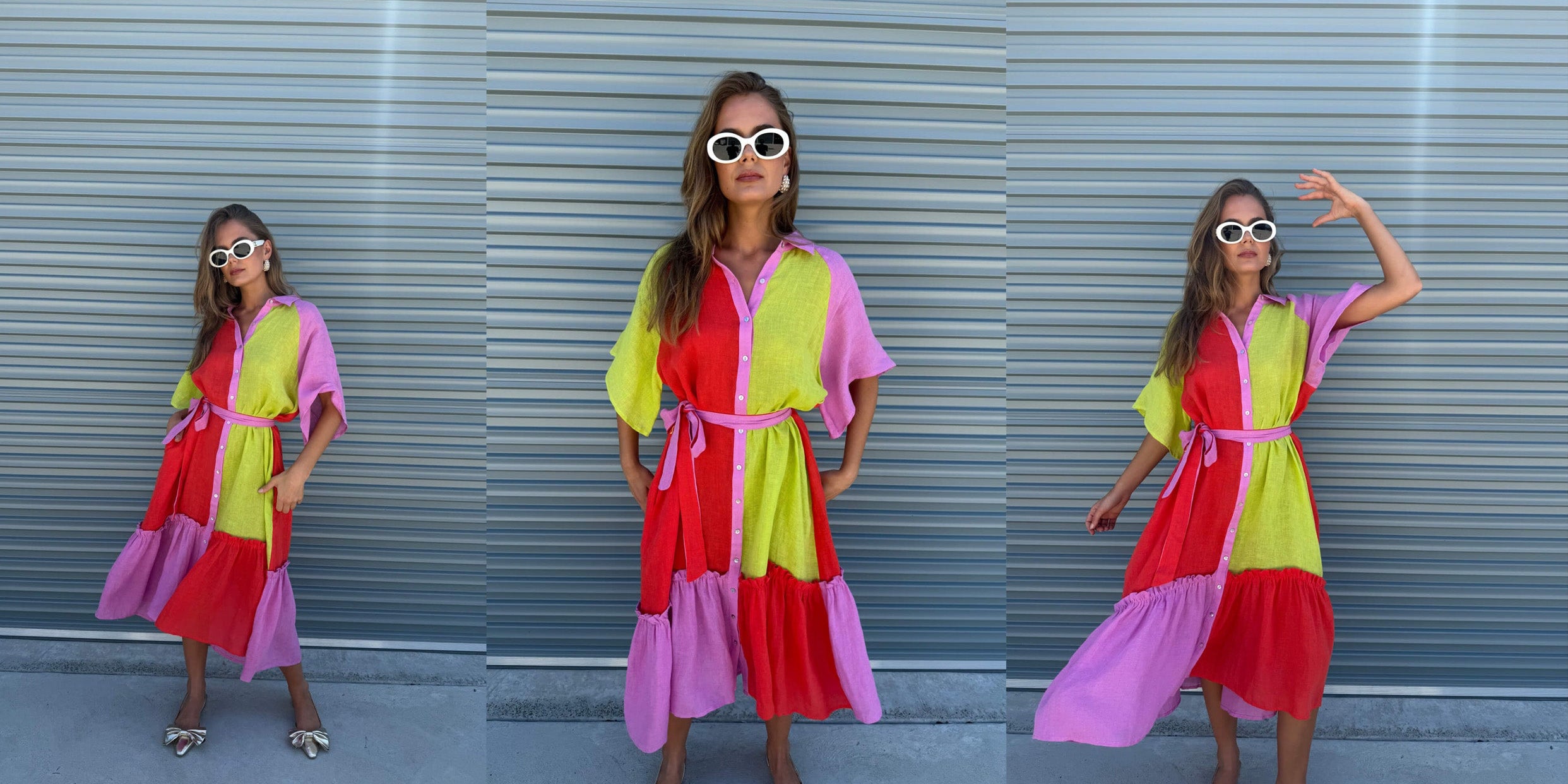 Woman wearing a colorful dress with a pink, yellow, and red design against a gray background.